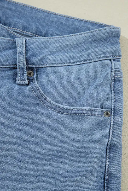 Light blue denim jeans pocket with stitching and rivets in urban edge asymmetrix collection