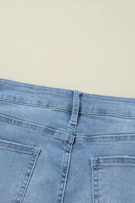 Urban edge asymmetrix: light blue denim jeans with back pockets & waistband for relax relax