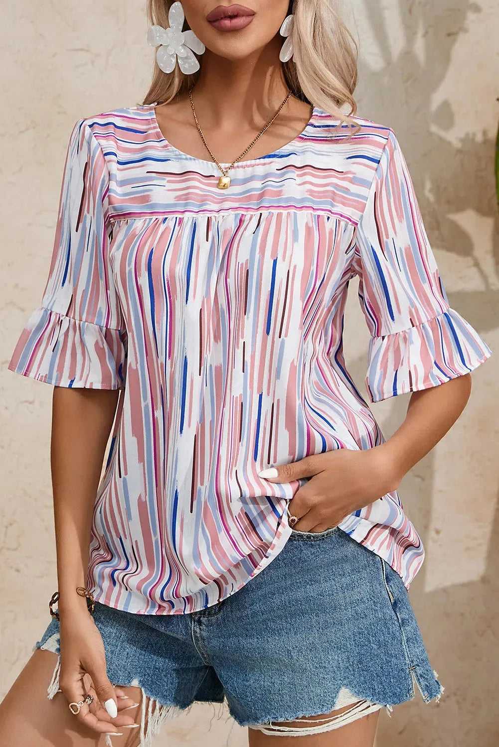Front close-up of the Rainbow Stripe Splash Blouse featuring ruffled half sleeves and a soft pastel color block design.