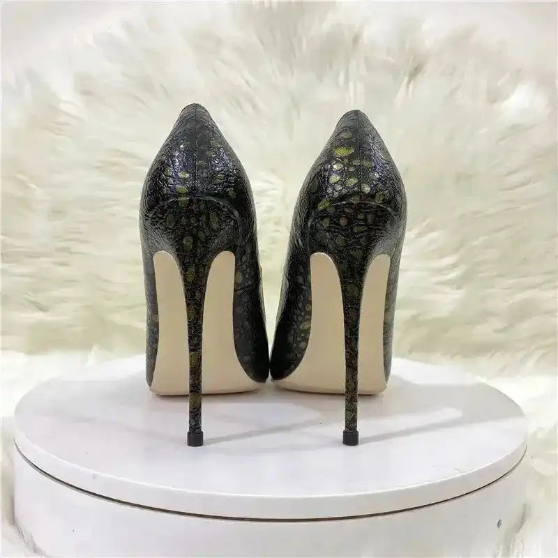 Rear view of snake-effect stiletto heels highlighting slim heel design and textured PU leather, perfect for statement pumps in UK fashion.