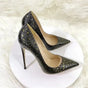 Snake-effect stiletto heels in black and green PU leather with pointed toes and high heels, perfect for statement retro pumps in the UK market.
