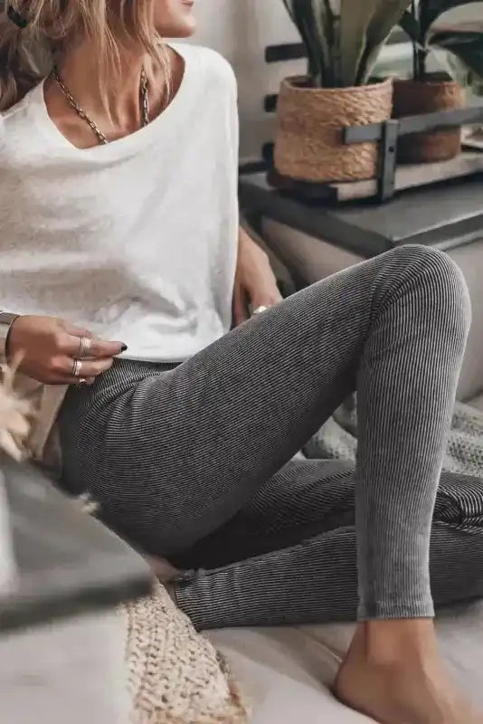 Vintage Wash Ribbed Leggings - Dark Grey styled casually indoors with a white top, showcasing the soft ribbed texture and snug fit.