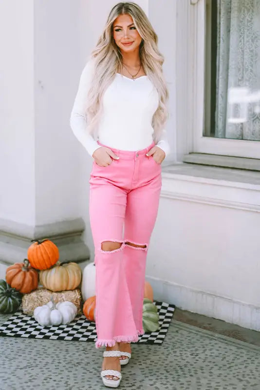 Pink vintage high waist flare leg ripped raw hem jeans