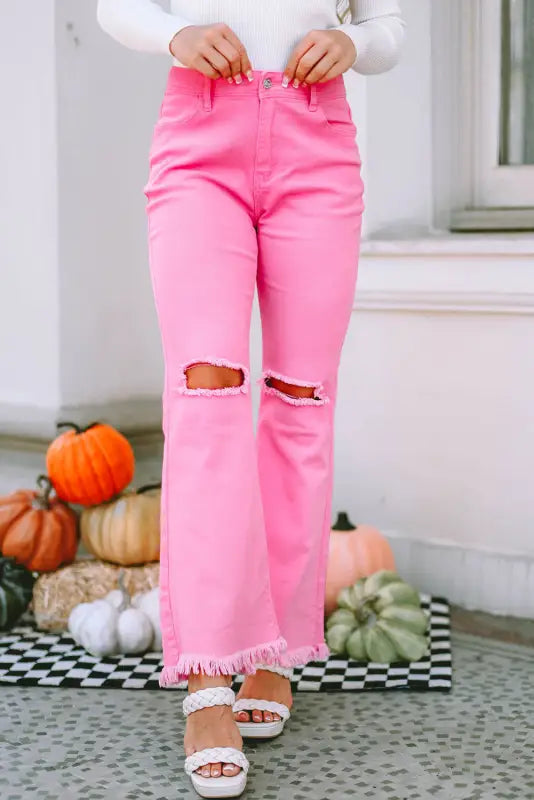 Pink vintage high waist flare leg ripped raw hem jeans