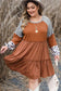 Rust-colored waffle ruffle plus mini dress with gray sleeves, hat, pendant necklace