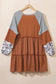 Waffle ruffle plus mini dress with tiered skirt and patterned sleeves on wooden hanger