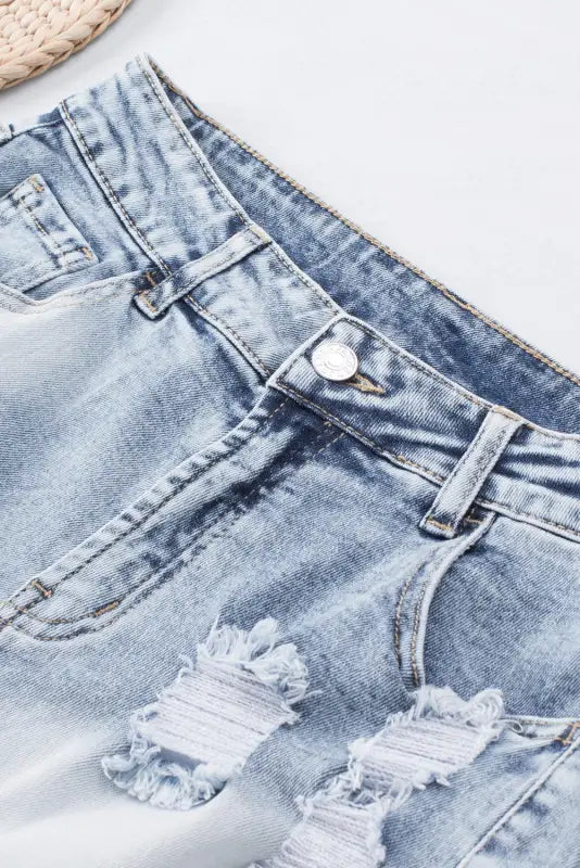 Washed distressed denim shorts: light blue jeans with thigh rips, perfect for a relax relax vibe