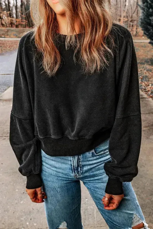 Close-up of V-shape open back cutout on acid wash sweatshirt Fashionfitz UK