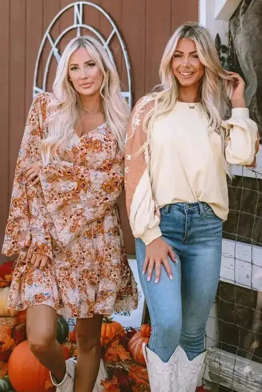 Western Print Long Sleeve Top paired with white cowboy boots, styled next to a floral dress for a rustic fall fashion vibe.