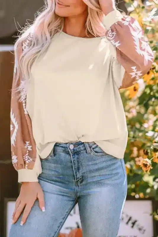 Western Print Long Sleeve Top with puff sleeves and Aztec pattern, styled for a casual fall outfit with denim jeans.