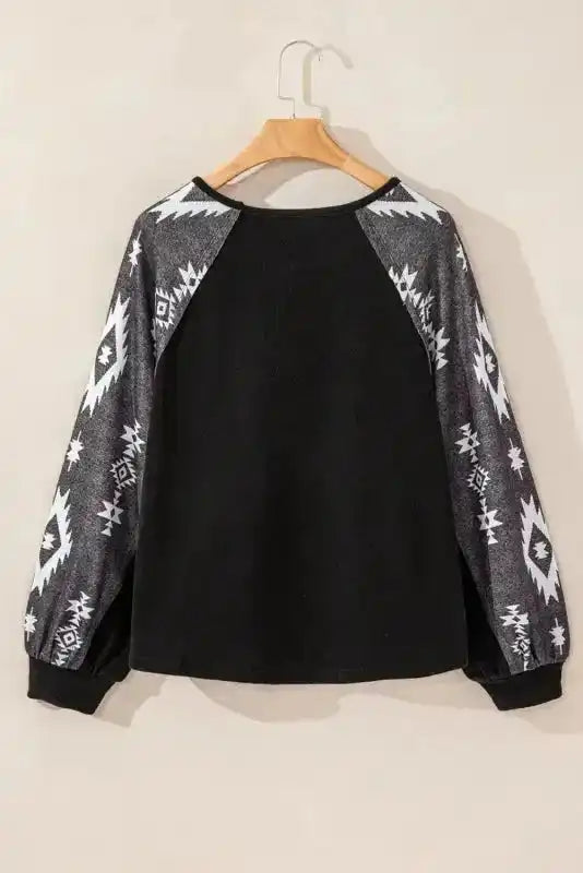 Back view of Western Print Long Sleeve Top showcasing full Aztec sleeve detail and relaxed fit for everyday comfort.