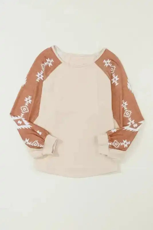 Flat lay of Western Print Patch Long Sleeve Top showing front view with beige body and brown Aztec print sleeves.