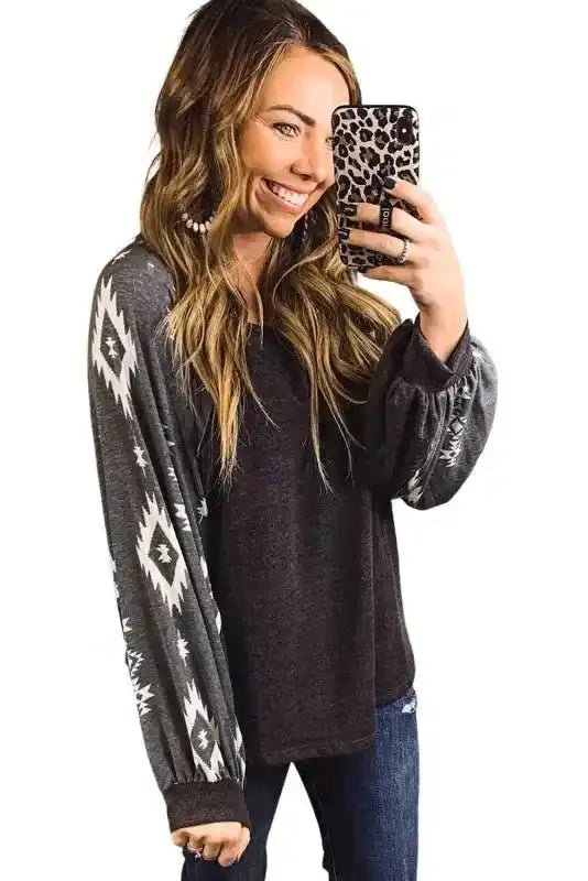 Western Print Long Sleeve Top with round neck and contrasting Aztec sleeves, perfect for cozy and trendy winter fashion.