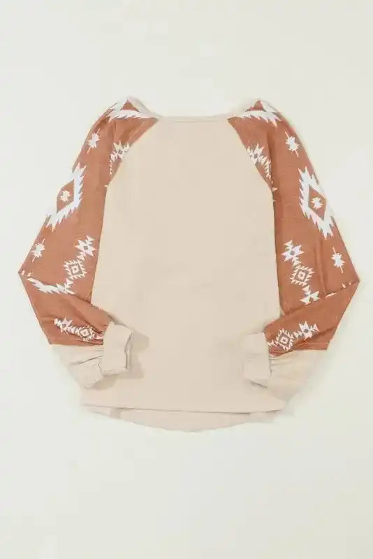 Back view of Western Print Long Sleeve Top in flat lay, featuring brown Aztec print sleeves and soft fleece material.