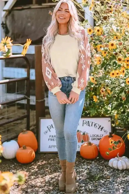 Beige Western Print Long Sleeve Top with brown Aztec sleeves, styled for a cozy and fashionable fall outfit.