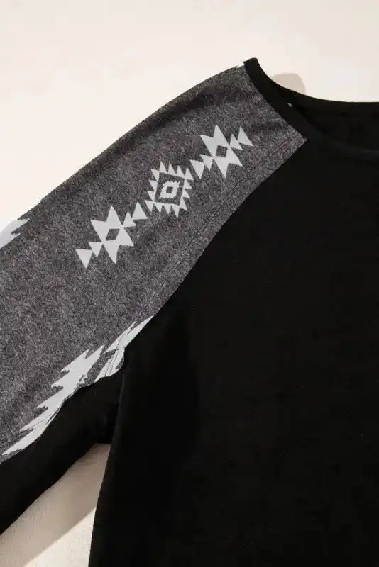 Close-up of Aztec print sleeve and neckline on the Western Print Patch Long Sleeve Top, showcasing its bold Western style.