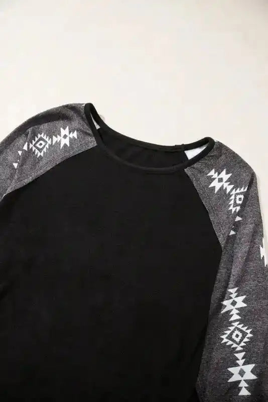 Top view of Western Print Patch Long Sleeve Top showing round neckline and tribal sleeve accents for a Western-inspired look.