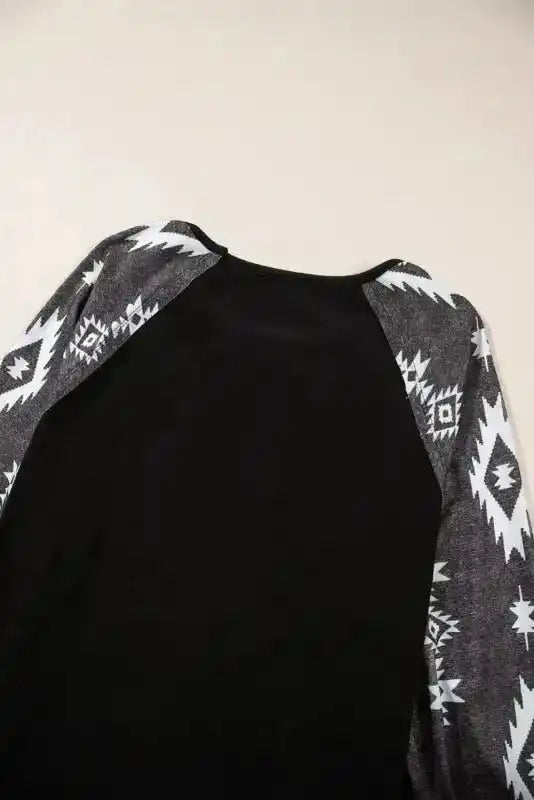 Back neckline and sleeve detail of the Western Print Long Sleeve Top, highlighting the contrast between solid and printed fabric.