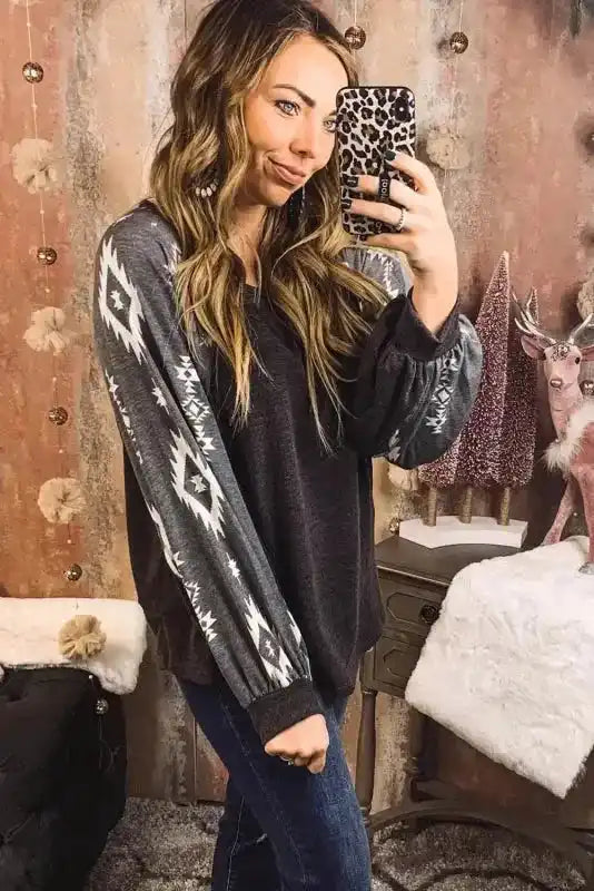 Side view of Western Print Patch Long Sleeve Top showing relaxed fit and tribal-inspired sleeve pattern for a stylish casual outfit.