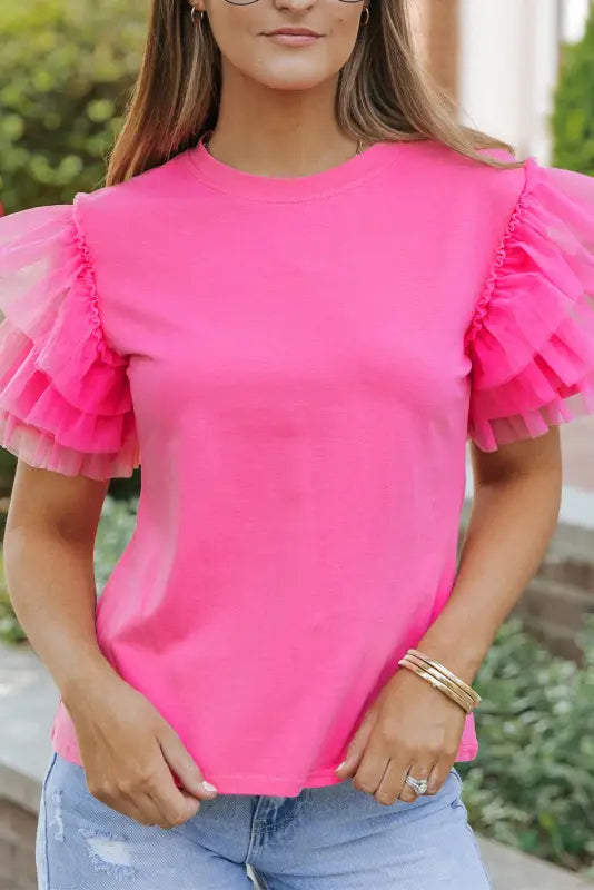 Whimsical wave blouse: bright pink t-shirt with ruffled tulle sleeves, perfect to relax relax