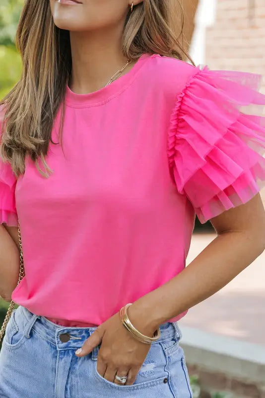 Bright pink whimsical wave blouse with ruffled tulle sleeves for a relax relax vibe