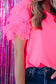 Whimsical wave blouse: bright pink top with ruffled tulle sleeves paired with blue jeans