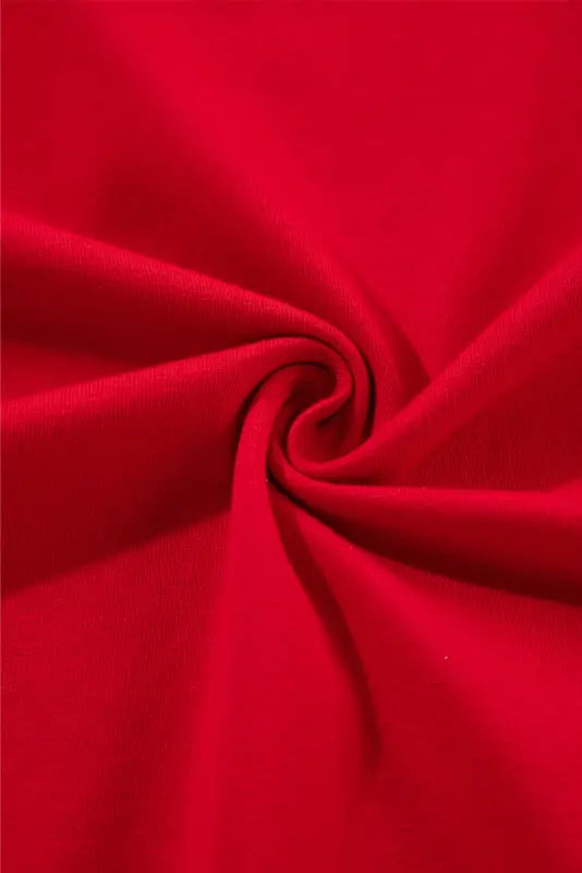 Swirled red fabric creating a spiral pattern on the whimsical wave blouse for relax relax momenten