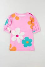 Women's floral bubble sleeve tee in pink, apricot, and black – short puff sleeves, round neckline, stretchable summer top.