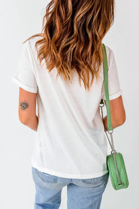 Woman with wavy hair in crew neck white t-shirt and jeans, viewed from behind - relax relax