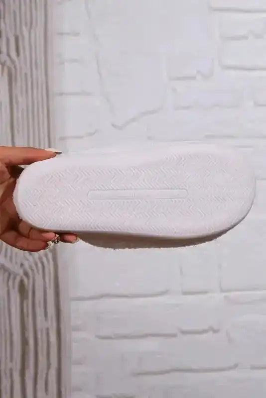Non-slip sole of White Christmas Deer Slippers with textured grip for indoor use. Ideal for cozy winter wear and holiday lounging.