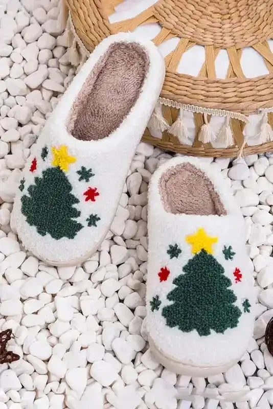 Top view of white Christmas tree slippers with plush interior and festive embroidered design, perfect for seasonal indoor use.