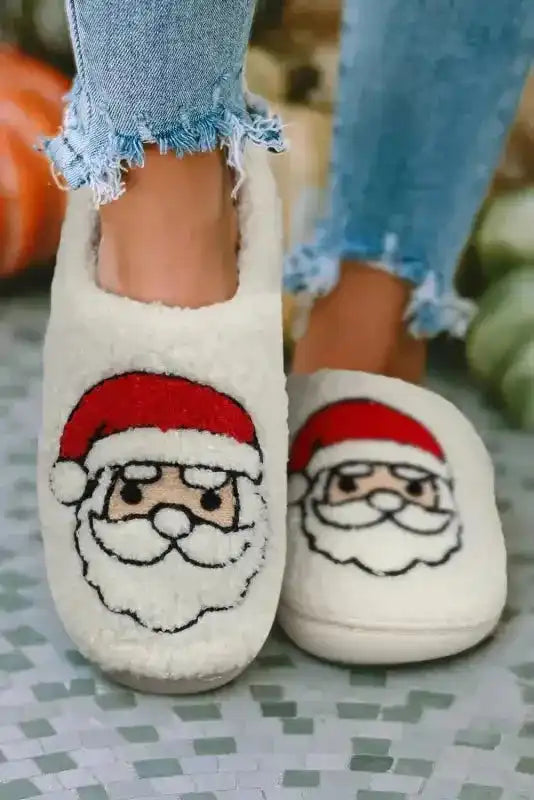 White Christmas Santa Claus Slippers with plush fleece and embroidered Santa face, perfect for cozy winter wear and festive home lounging.
