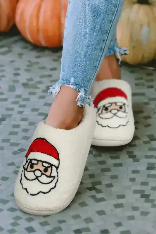 Front view of White Christmas Santa Claus Slippers featuring cute Santa graphics, designed for winter indoor use and holiday style.