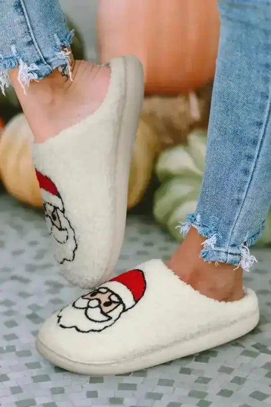 White Christmas Santa Claus Slippers in motion, highlighting plush material and festive design for seasonal home comfort.