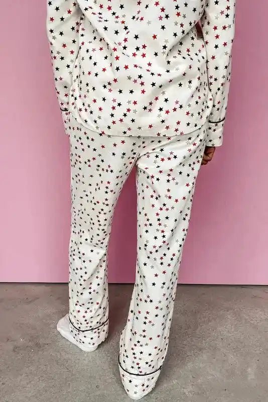 Back view of White Star Panel Pyjama Set showcasing full-length pants with star print and relaxed fit. Comfortable women’s loungewear option.