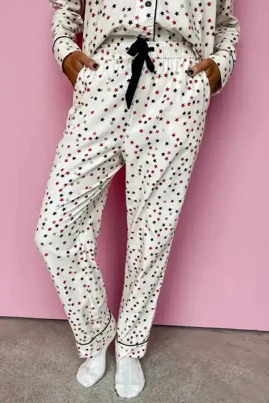 Lower half of White Star Panel Pyjama Set highlighting drawstring waist and cuffed pant hems. Casual and cosy women’s pyjama bottoms.