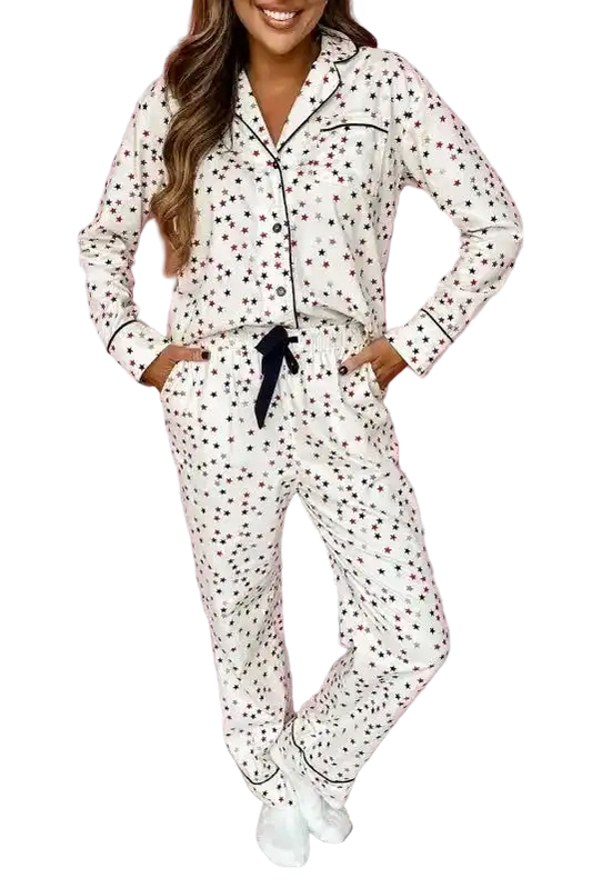 White Star Panel Pyjama Set for women featuring red and black star print, long sleeves, and contrast piping. Ideal for cosy nights in.
