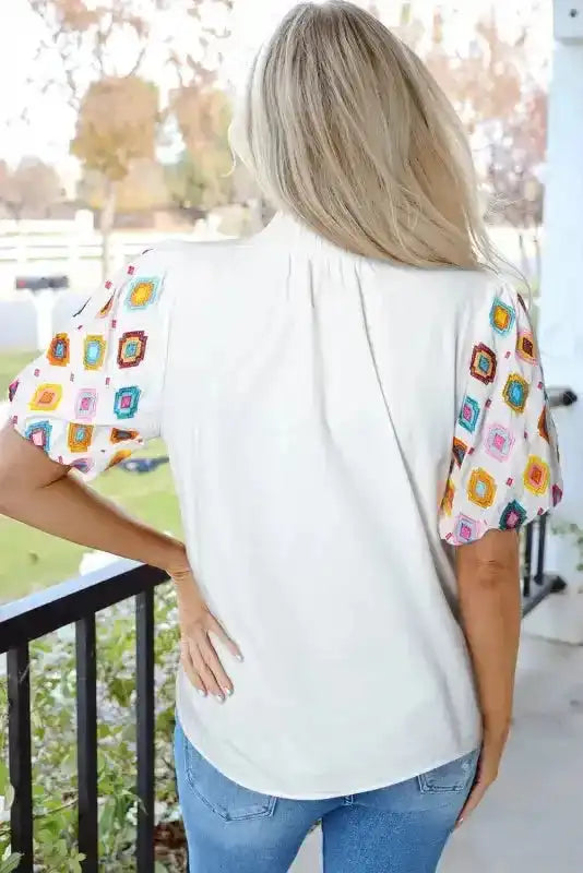 Back view of medium-length White Embroidered Smocked Neck Puff Sleeve Top - Fashionfitz