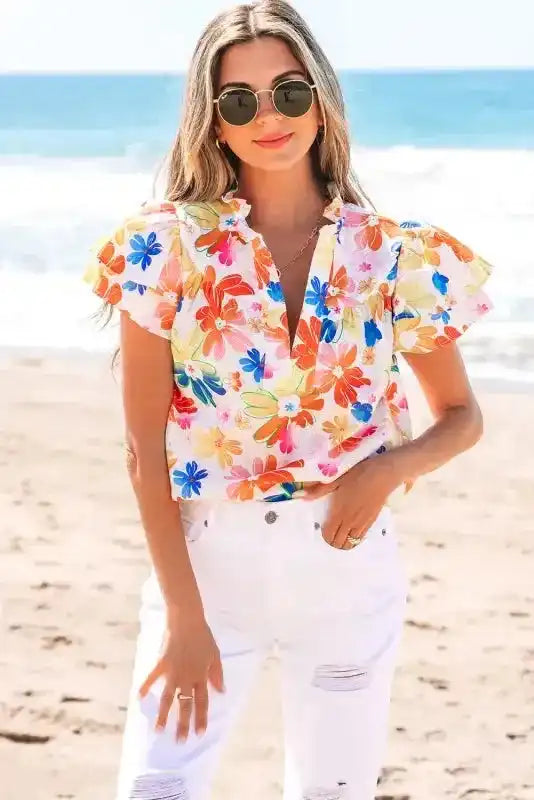 Close-up of White Floral Flutter Sleeve Cotton Blouse showing delicate floral print and flutter sleeve detail — Fashionfitz