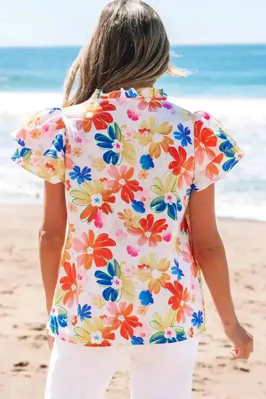 Back view of White Floral Flutter Sleeve Cotton Blouse showing V-neckline and relaxed silhouette — Fashionfitz
