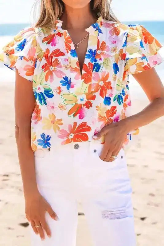 Side view of White Floral Flutter Sleeve Blouse showing graceful flutter sleeve movement and breathable fabric drape — Fashionfitz