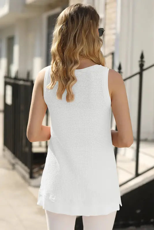 White flowy tunic tank top on a woman with long blonde hair, perfect for a relax relax vibe