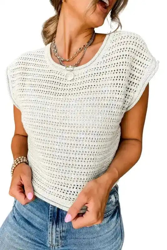 Close-up of White Knit Cap Sleeve Tee showing detailed hollow-out knit pattern and soft round neckline for cozy wear.