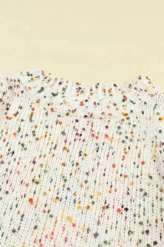 Close-up of neckline on White Pilling Detail Patterned Sleeve Sweater showing ribbed collar and multicolor speckled yarn.
