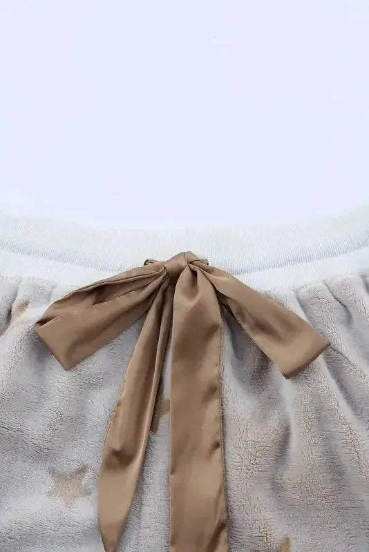 Fashionfitz white plush lounge set featuring soft shorts with a decorative bow tie