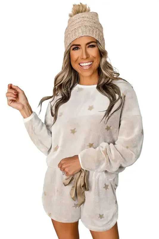 White plush lounge set with star patterns, perfect for comfortable casual wear and relaxing at home