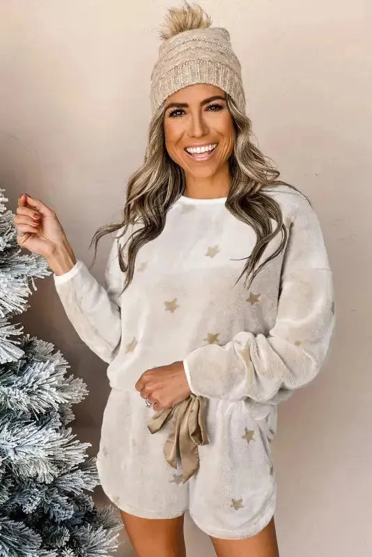 Fashionfitz white plush lounge set featuring a cozy long sleeve top and shorts with star patterns