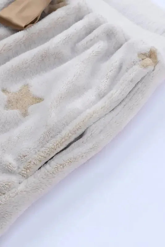 Fashionfitz white plush lounge set featuring soft fabric and star details for comfortable lounging