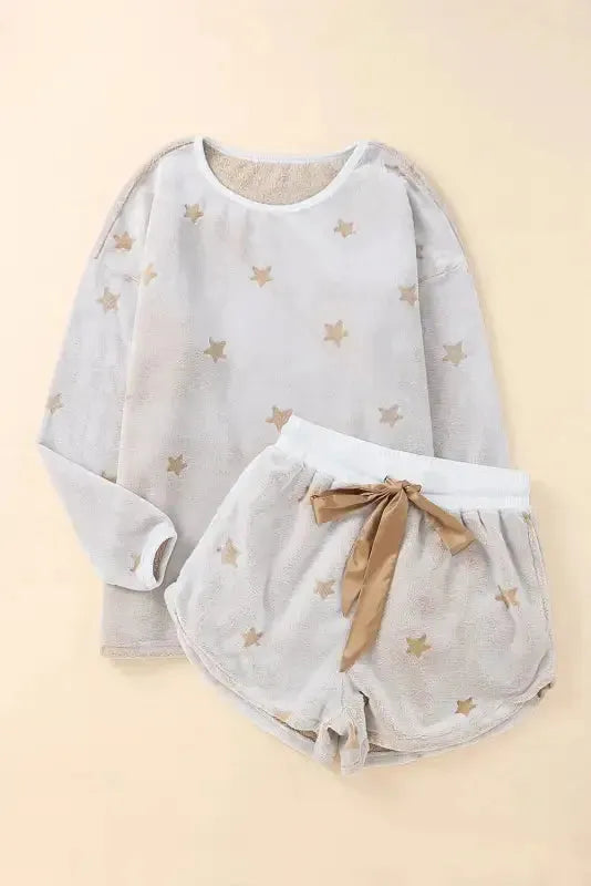 Fashionfitz white plush lounge set featuring a cozy top with star patterns and matching shorts