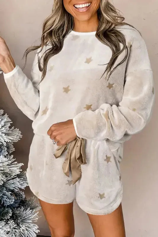 Fashionfitz white plush lounge set featuring a cozy long-sleeve top and shorts, adorned with star patterns